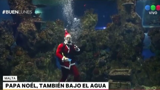 Papá Noel, desde las alturas de un rascacielos hasta el fondo del mar