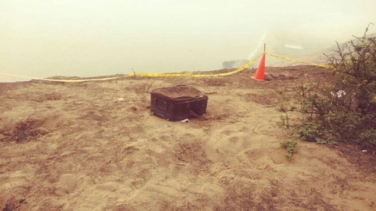 Encontraron restos de mujer carbonizada dentro de una valija que estaba en un descampado